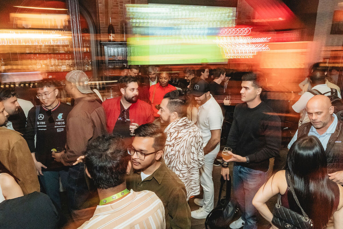 Crowd mingling at Step happy hour